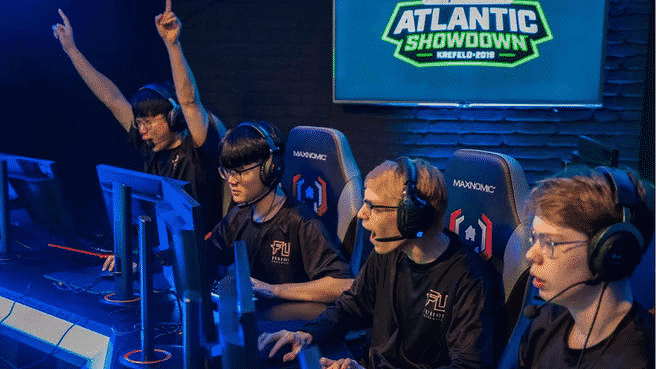 Fusion University's Overwatch roster cheer as they take the winning game at the Atlantic Showdown