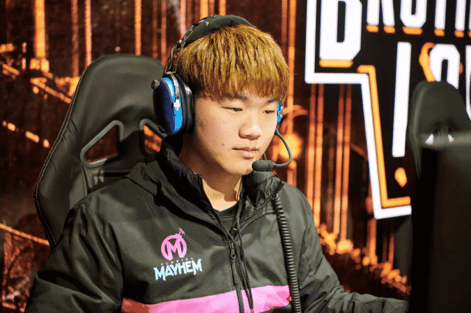 Overwatch League player Pan-seung "Fate" Koo in a Mayhem jacket playing Overwatch on stage