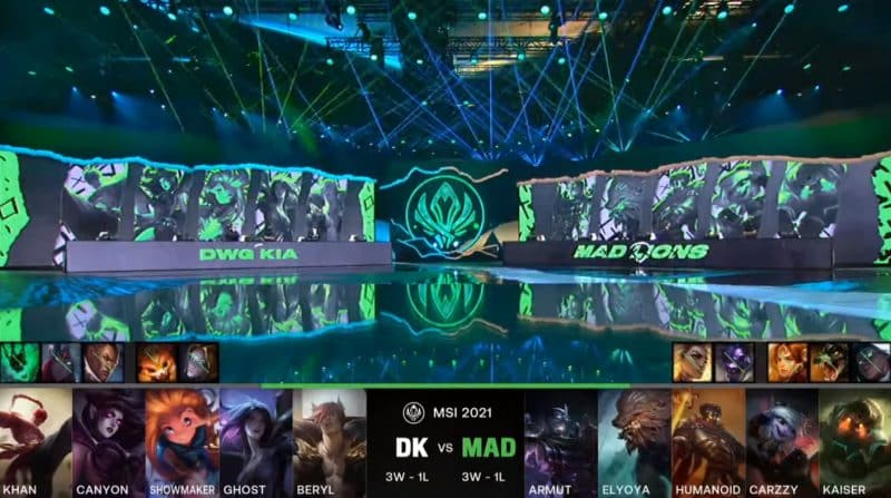 A screenshot from the LoL Esports broadcast for the Mid-Season Invitational (MSI) match between DAMWON KIA and MAD Lions. The picked and banned champion drafts appear at the bottom of the image with a shot of the 2021 MSI Stage above.