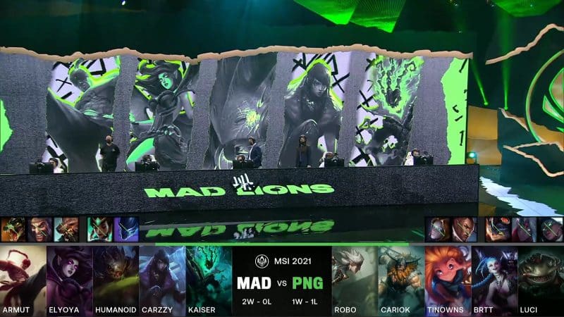 A screenshot from the LoL Esports broadcast for the Mid-Season Invitational (MSI) match between MAD Lions and paiN Gaming. The picked and banned champion drafts appear at the bottom of the image with a shot of the 2021 MSI stage above.