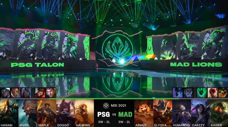 A screenshot from the LoL Esports broadcast for the Mid-Season Invitational (MSI) match between PSG.Talon and MAD Lions. The picked and banned champion drafts appear at the bottom of the image with a shot of the 2021 MSI Stage above.