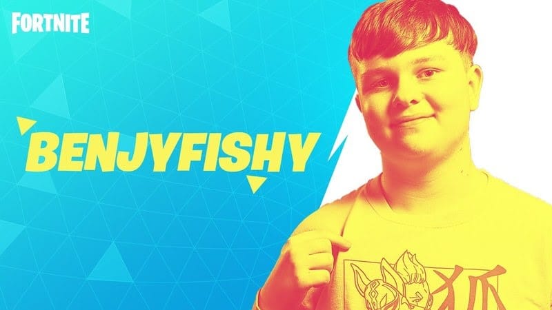Pro Fortnite player Benjy "Benjyfishy" David Fish gives a thumbs up next to his name in a yellow filter on a blue and white background.