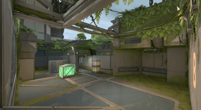 A screenshot of the new Valorant map Fracture, showing the jungle biome half with greenery growing throughout the facility.